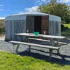Front view of Llyn Yurt with Picnic table