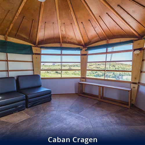 Inside Caban Cragen, the seating area and view of the hills fromthe window
